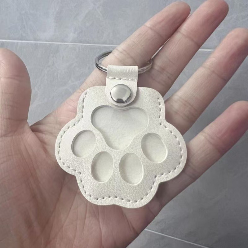 White keychain, bag, pack