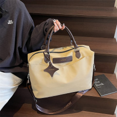 新型ファッション男女フィットネスバッグシンプル大容量セットタイロッド荷物袋斜め掛け搭乗旅行収納バッグ