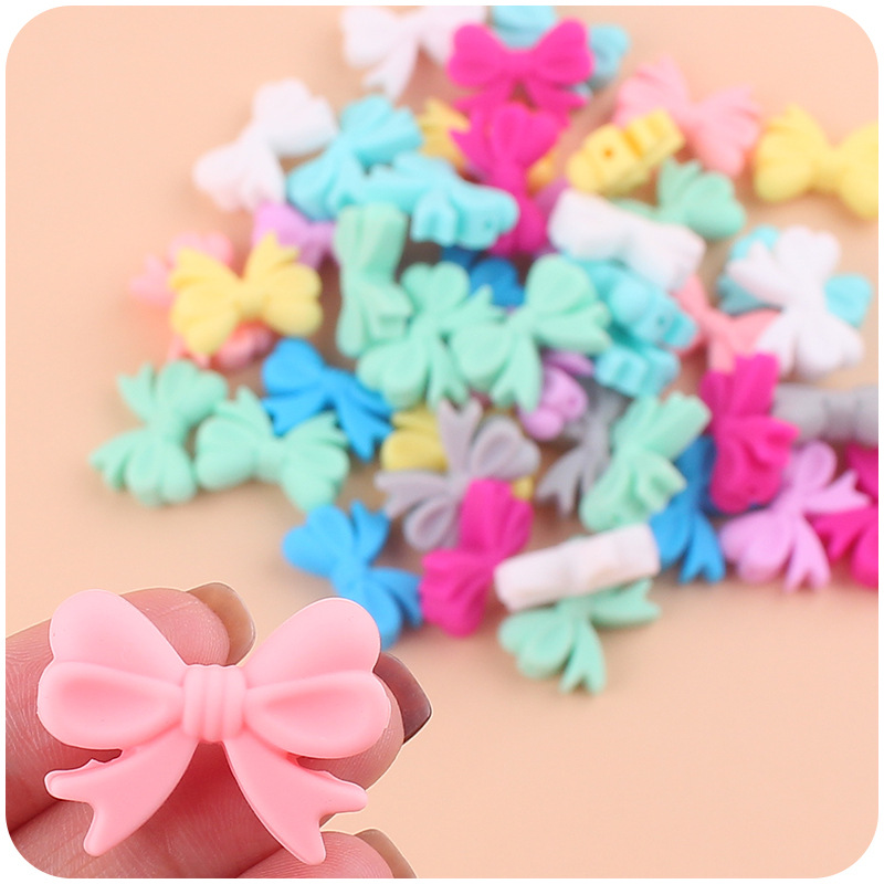 Bebé suministros de dibujos animados de silicona arco pequeño mordedor creativo bebé pezón anti-gota cadena pulsera mordedor Accesorios