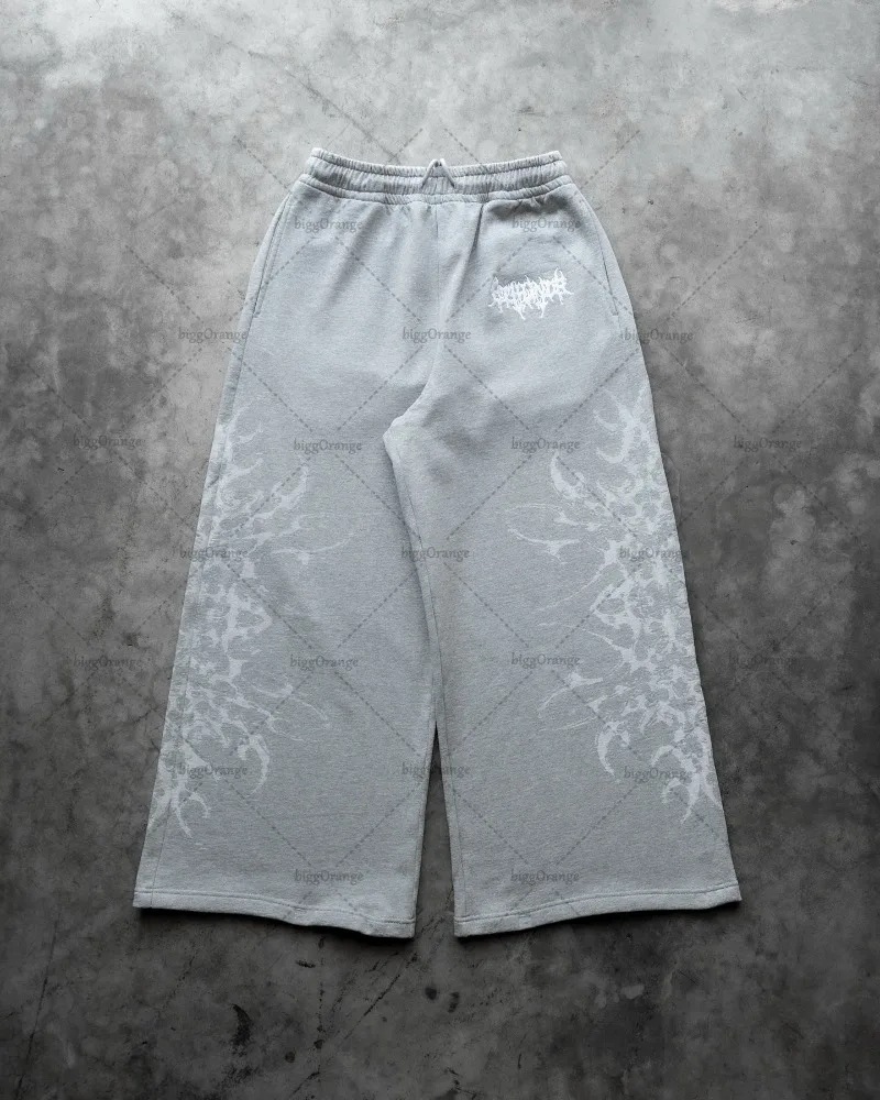Europa y Estados Unidos transfronterizos estadounidenses tendencia hip-hop personalidad callejera pull-out pantalones casuales de moda impresa pantalones rectos sueltos