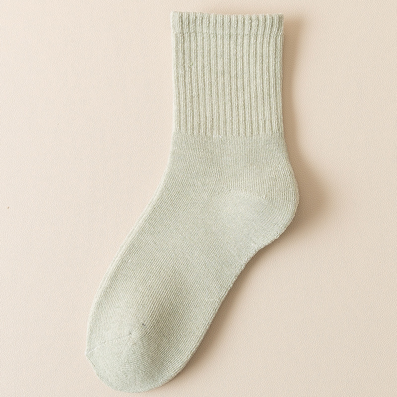 Calcetines de mujer de invierno forrado de lana gruesa caliente Terry Calcetines de piso de otoño e invierno de color sólido a media pantorrilla Zhuji calcetines al por mayor