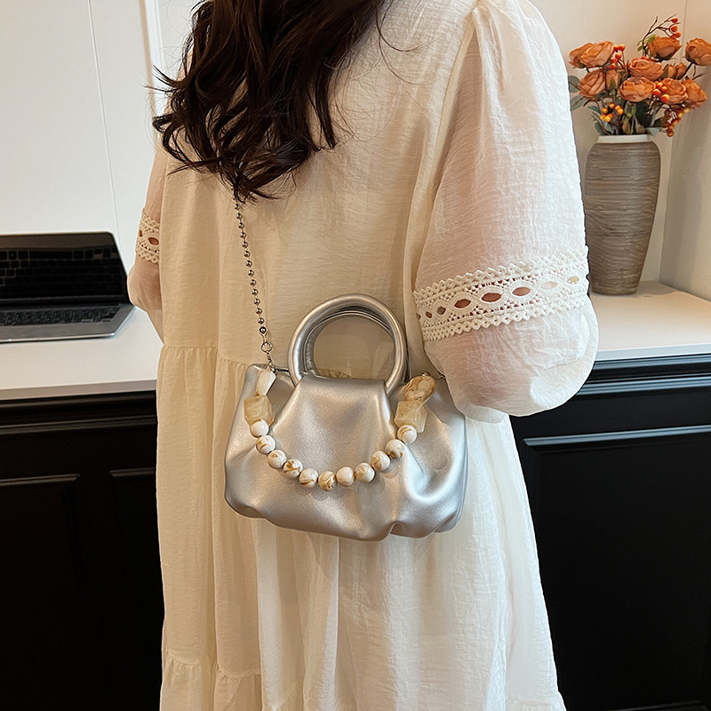 High end handbag for women in 2024, new niche design, summer handheld pleated chain strap, crossbody cloud bag_voghion.com