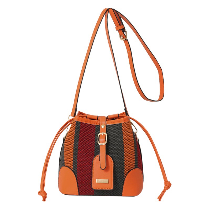 Diseño de nicho de moda bolsa de cubo portátil para mujeres 2023 nueva moda lienzo contraste color rayas hombro bolsa de mensajero