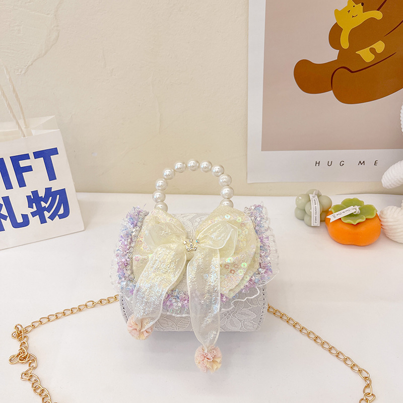 Bolso infantil de perlas 2024 nueva chica arco de moda, bolsa de tramo inclinada, princesa de moda, accesorios de algodón y lino, bolso