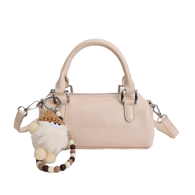 Nicho de diseño retro bolso de mano mujer 2026 primavera nuevo bolso de hombro sensación diaria de moda oblicuo bolso cilíndrico