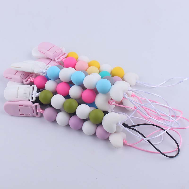 Nuevo bebé suministros de dibujos animados amor silicona DIY creativo macaron color serie mordedura cola molar pezón