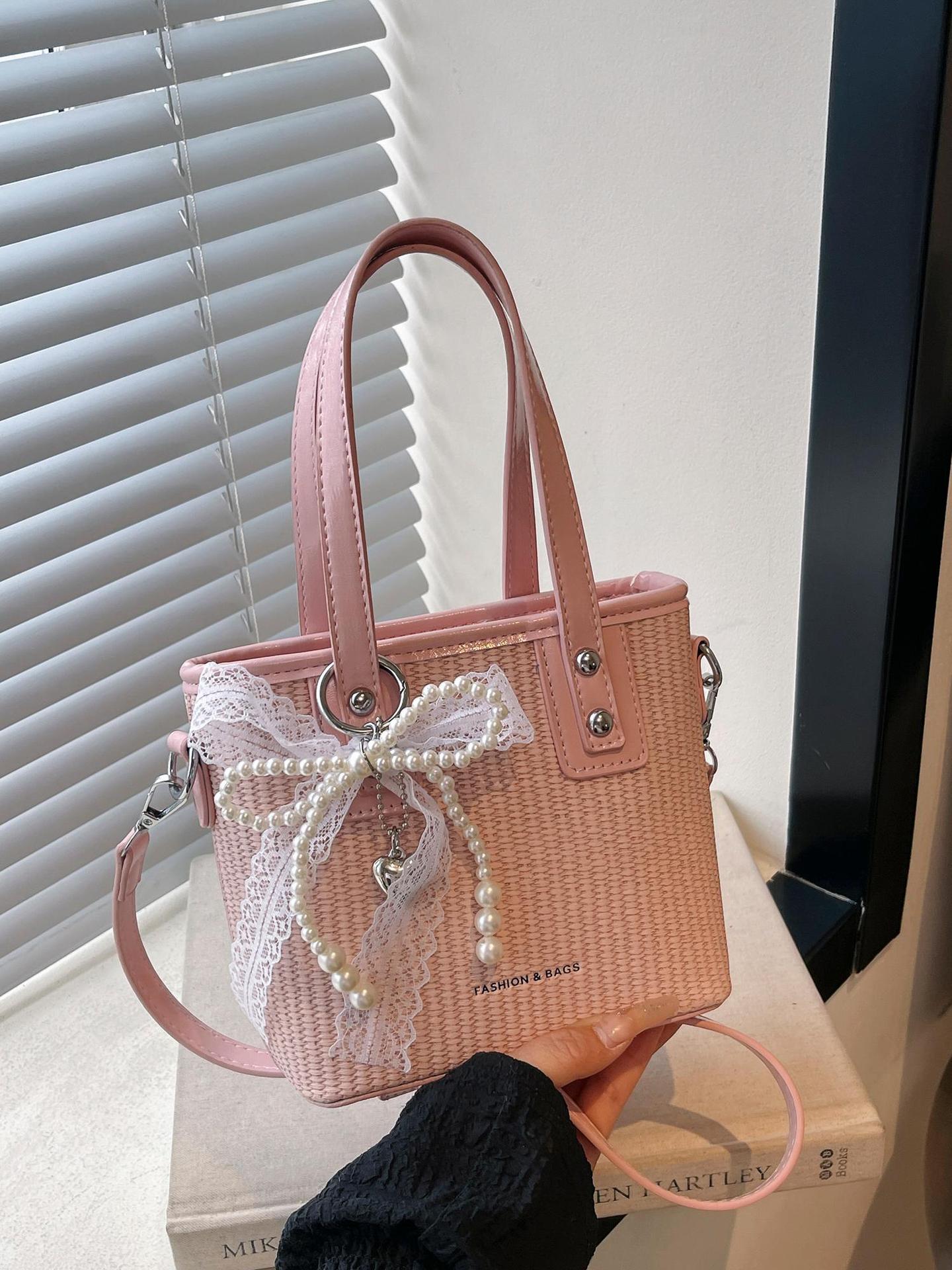 Bolsa de balde de mano caliente de verano para mujeres 2025 nueva bolsa de playa de vacaciones de playa bolsa de tejido bolsa de paja