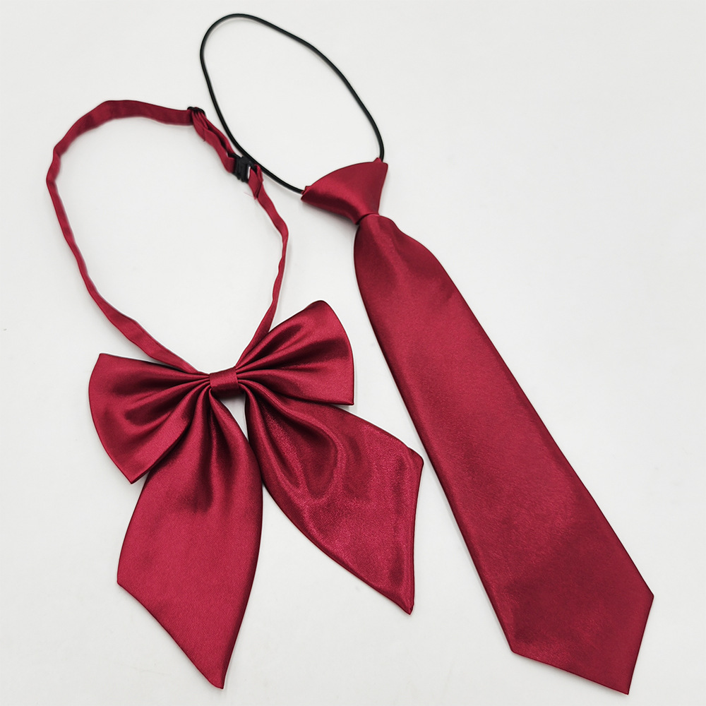 Spot de fábrica al por mayor conjunto de pajarita de corbata para niños de escuela primaria, corbata a rayas de color sólido, pajarita de raíz de plumas