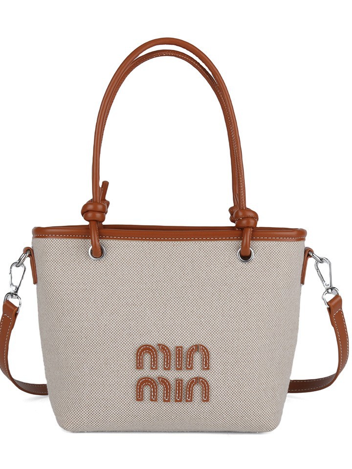 Bolso de cubo portátil de alta gama para mujer 2025 nuevo bolso de mensajero de color de contraste de tela de tendencia transfronteriza del sudeste asiático