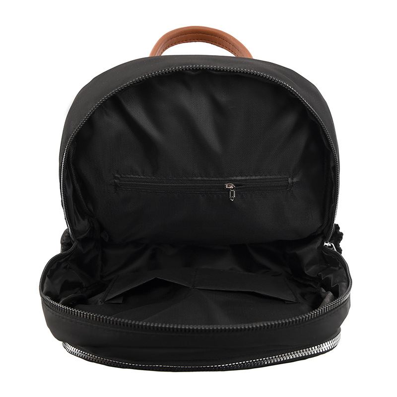 Comercio exterior al por mayor 2023 nueva mochila de tela Oxford para mujer retro casual, bordado de moda, mochila de viaje ligera