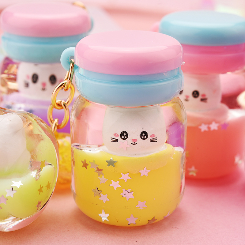 Cute Acrylic Simulation Yogurt Bottle Floating Kitten Doll Keychain Wholesale Nihaojewelry display picture 3