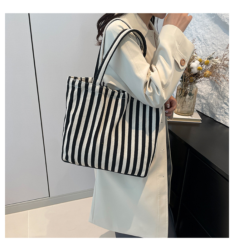 2024 Autumn/Winter new versatile and fashionable striped handbag shopping bag, two-tone large-capacity trendy single-shoulder bag undefined