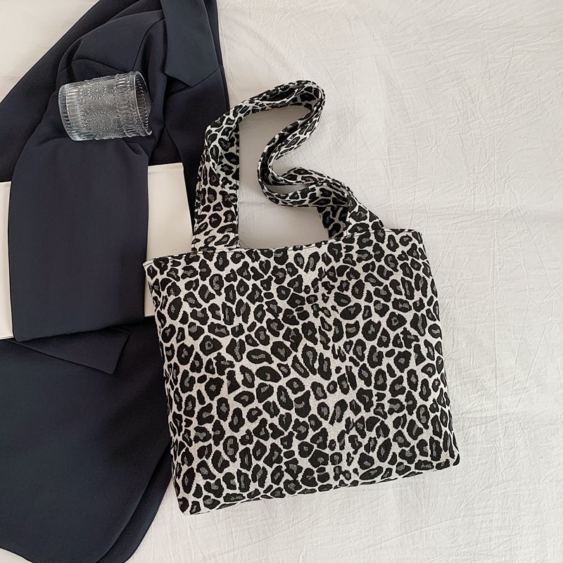 Bolsa de lona de leopardo para mujeres 2024 nuevo otoño y invierno ocio versátil mochila de hombro de viaje tote