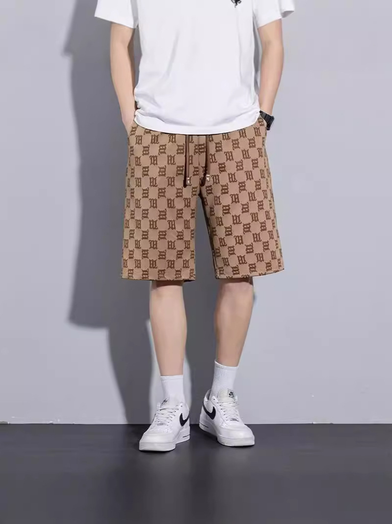 Camisas de ropa de seda de hielo delgada pantalones cortos casuales sueltos de verano estilo de Hong Kong pantalones de playa de hombre de moda pantalones casuales