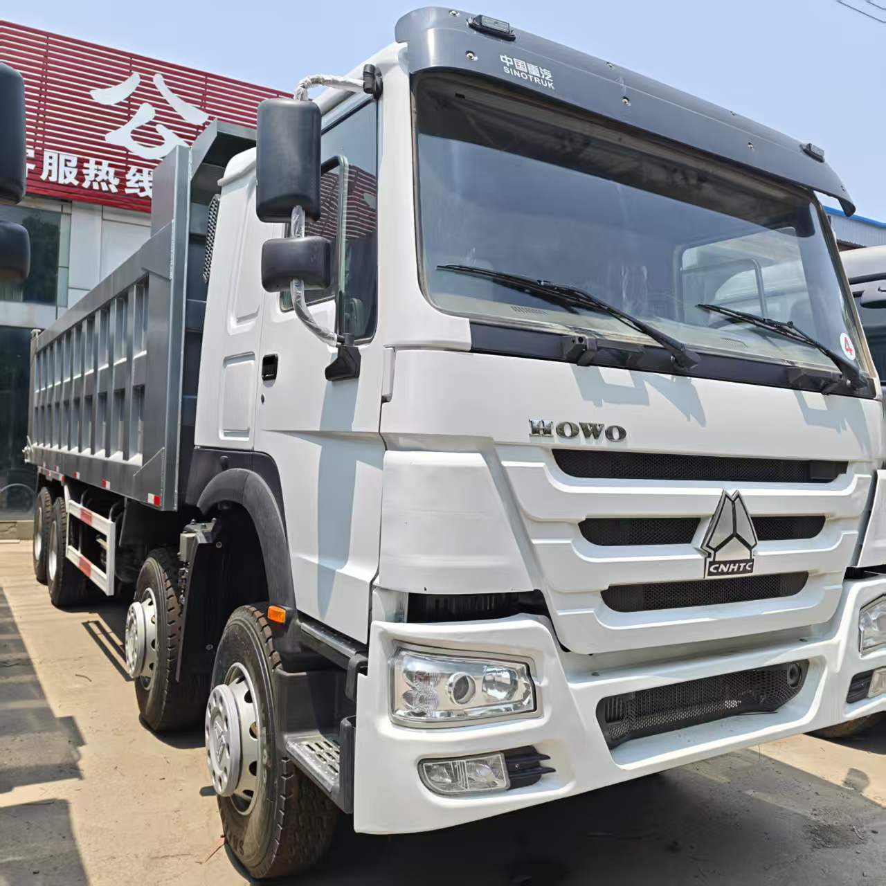 Current Stock for Export: Howo Dump Truck 8X4 Earthmoving Transport Tipper Truck, Heavy-Duty Dump Truck, Earthmoving Truck Parts