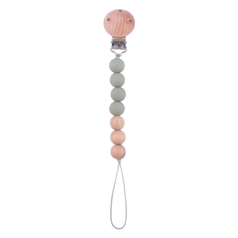 Productos para bebés y niños pequeños agujeros redondos de abóbulo cadena de chupeta para calmar al bebé Zheng Zheng