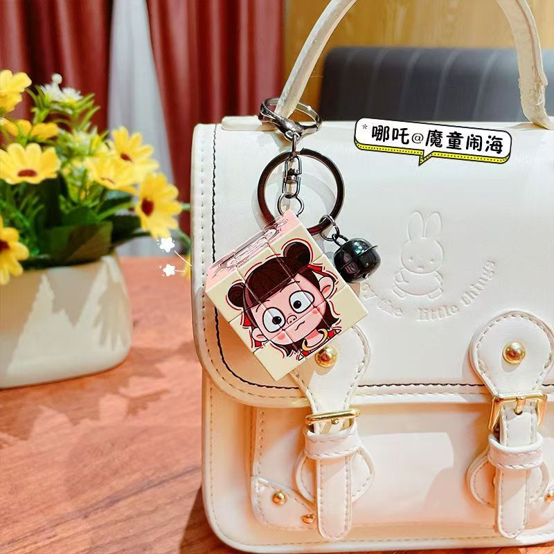 Nezha's Devil Boy Naohai Patrón de dibujos animados creativos Cubo de Rubik Llavero Bolsa Colgante Llavero Regalo pequeño al por mayor