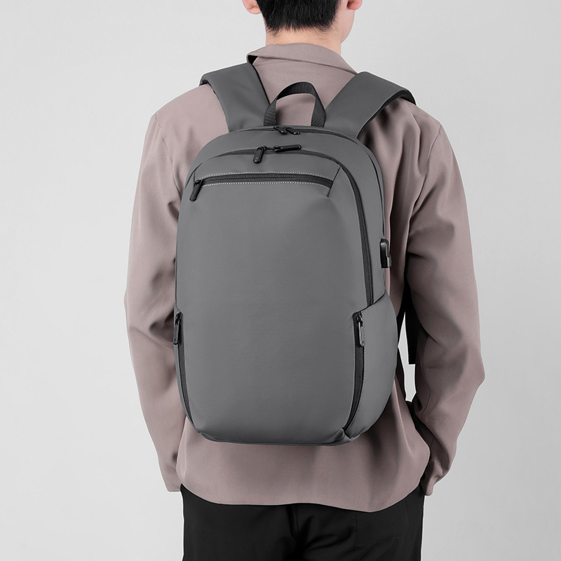 Nuevo bolso de computadora de hombro transfronterizo, película de cuero, bolso de negocios resistente al agua, mochila para estudiantes universitarios, mochila de viaje y ocio para hombres