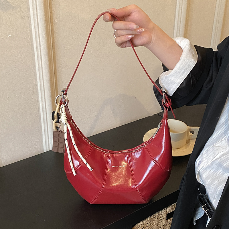 Transfronterizos coreanos perezosos bolsas de brazo de cera nicho bolsas de cuerno de piel de cera 2026 nuevas bolsas de brazo diarias mujeres