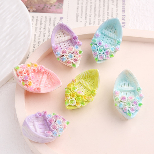 Cartoon DIY resin accessories and decorations: flowers, small boats, cream glue, handmade hair clips, phone cases, shoe clips, and other accessories.