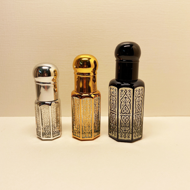 Botella de aceite de cristal revestido con láser, sub-embotellado, botella de perfume con cuentagotas sellada en espiral, fabricante de botellas de bolas rodantes al por mayor octogonal