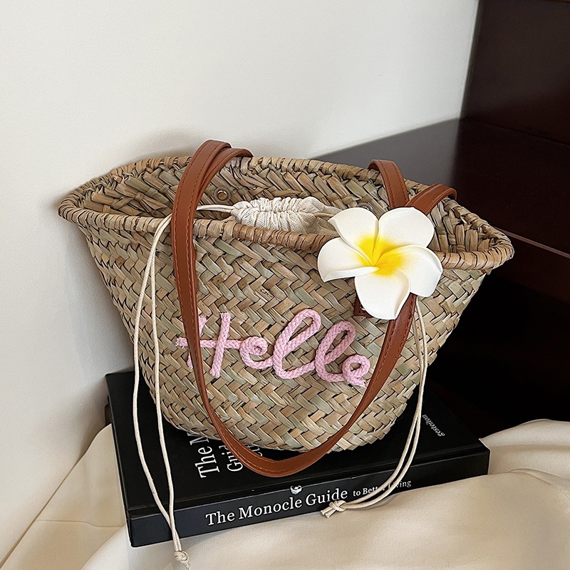 Bolso de verano para mujer, bolso versátil 2025, bolso de hombro de paja tejido sencillo para vacaciones, nuevo estilo.