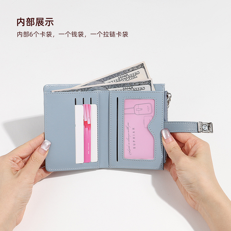 Diseño 2024 nuevo verano pequeño fresco desmagnetismo antirrobo monedero plegable bolso de tarjeta de estudiante billetera corta nicho femenino