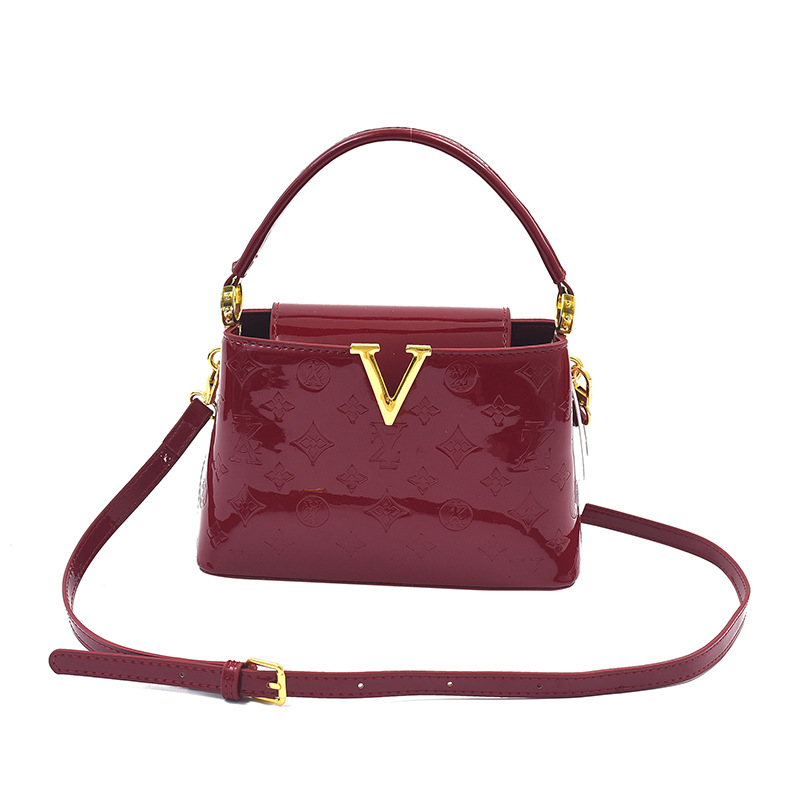 Bolso de alta calidad con textura 2025 verano nuevo bolso femenino con letras en relieve bolso de hombro charol brillante bolso de mensajero marea