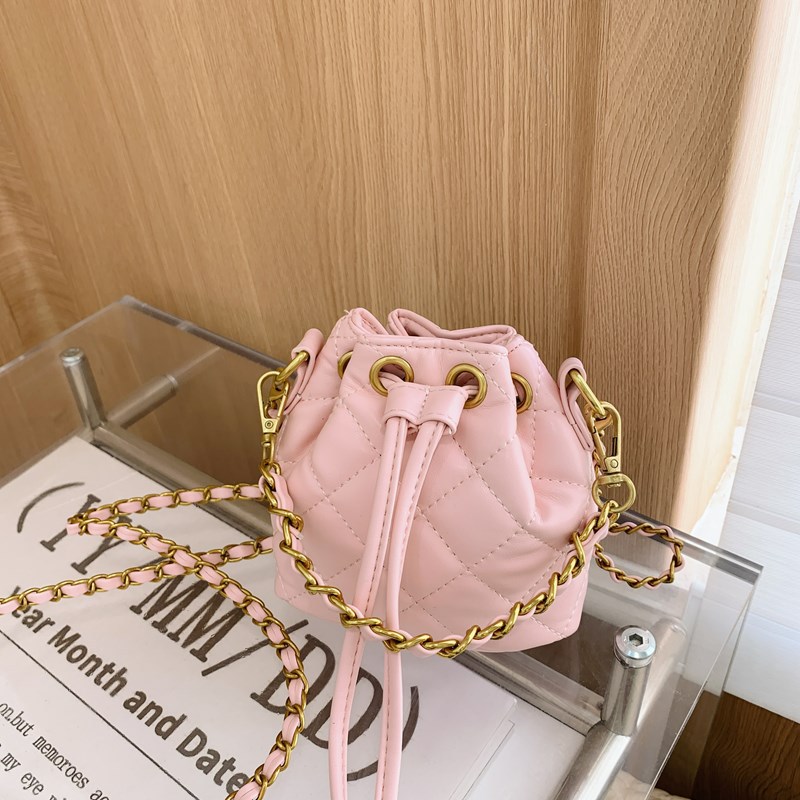 Bolso de hombro para niños y niñas Lingge de moda, cordón de aire extranjero, bolso de cubo de bebé de color sólido simple, nuevo bolso de cadena para niños