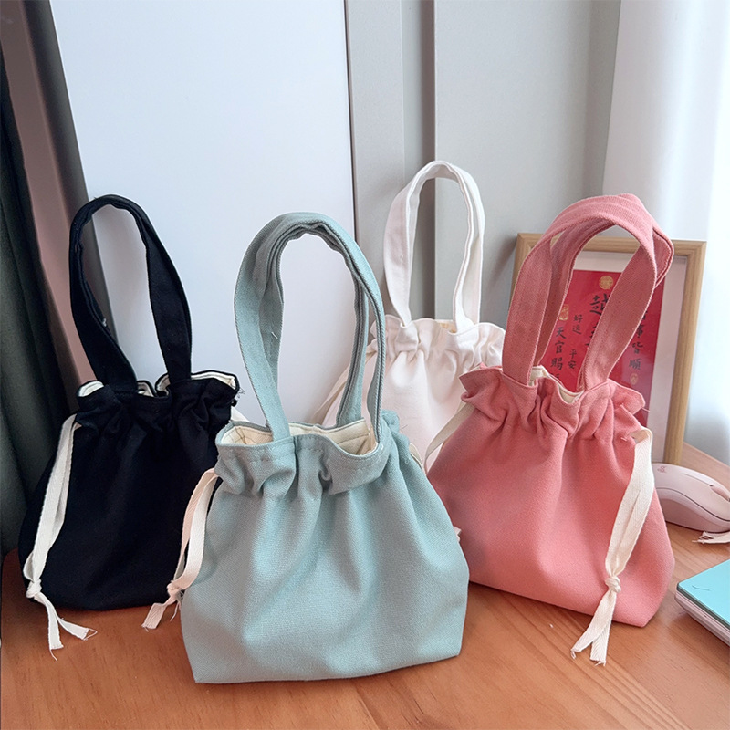 简约帆布包女新款日系甜美风托特包手提抽绳文艺束口单肩帆布袋
