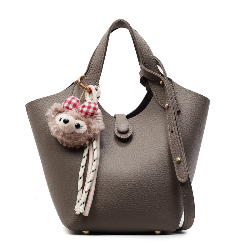 Bolso de canasta de verduras transfronterizo para mujer 2025 nuevo bolso de hombro casual simple bolso de cubo de mensajero de cuero suave de todo fósforo