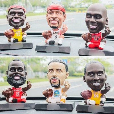 Car ornaments: Stars James, Messi, and