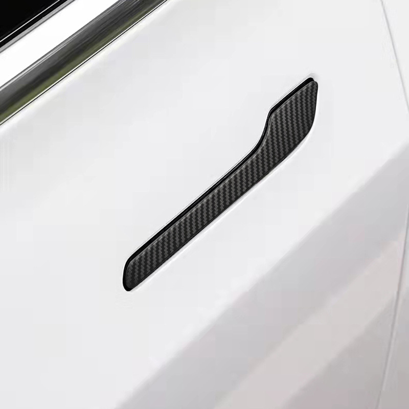 テスラ熙新版モデルを適用して、ドアの取っ手に炭素繊維の取っ手を貼って、ドアの取っ手に傷をつけないようにして、装飾を貼って改造します。|undefined