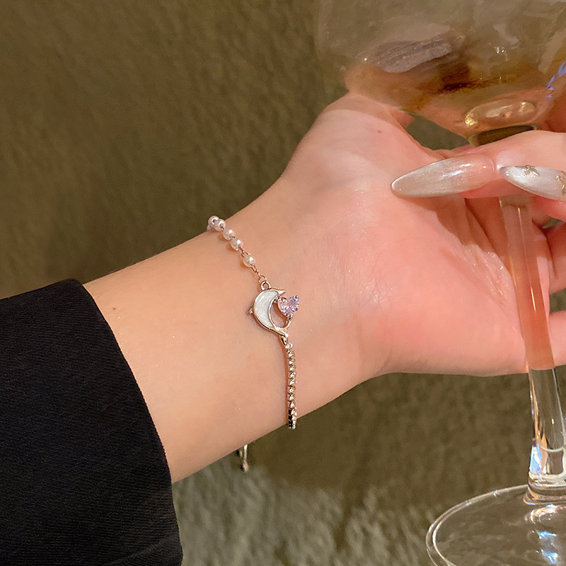 Pulsera de perlas de sentido avanzado de nicho de lujo ligero, temperamento de moda coreano femenino, pulsera de amor de circón intermitente, pulsera de cristal