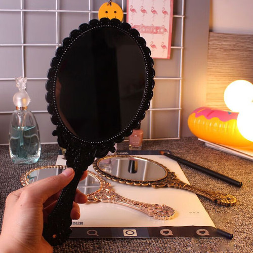 Retro handheld makeup mirror with European floral edge handle mirror hole design, high-definition mirror surface small mirror