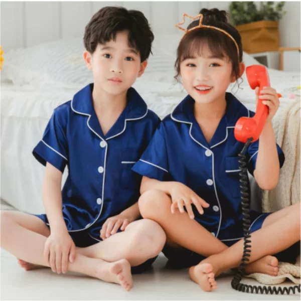 High-density silk-like children's summer pajamas short-sleeved shorts small lapel solid color cute small and medium-sized children's home clothes simple