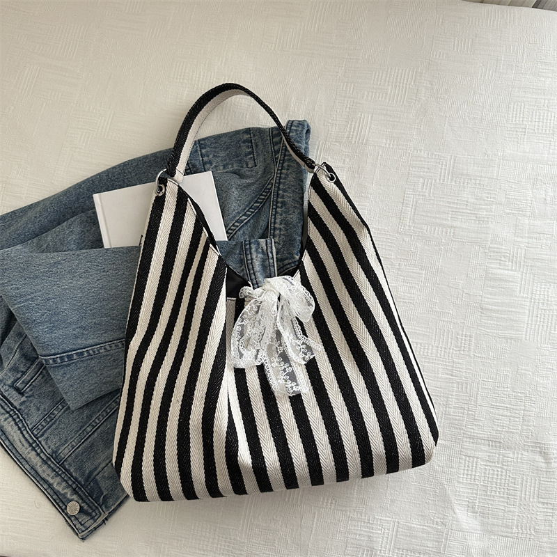 Bolsa de lona a rayas para mujeres verano 2024 nueva moda nicho coreano bolso especial bolso de tela de gran capacidad para estudiantes
