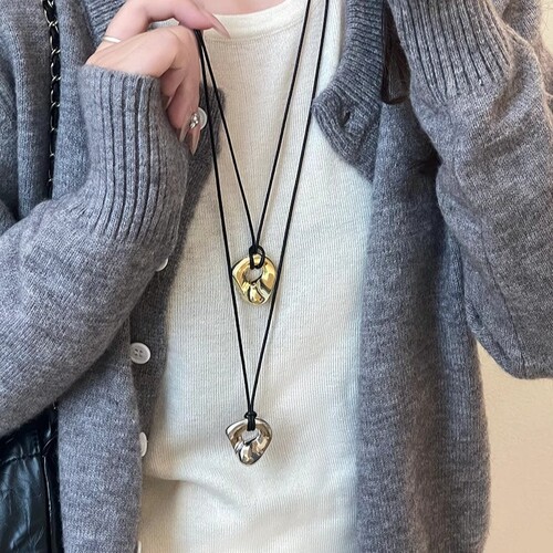 Japanese-style abstract hollow metal pendant necklace for women, minimalist fashion leather cord long-chain sweater accessory, lightweight luxury niche accessory