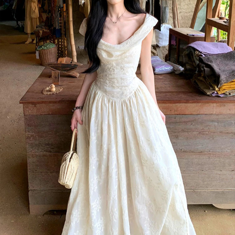 A Sweet Peach-Colored Yikett "Victoria" Spaghetti Strap Dress for Women, a Stunning French-Style Mini Dress for Summer A Sweet Peach-Colored Yikett "Victoria" Spaghetti Strap Dress for Women, a Stunning French-Style Mini Dress for Summer