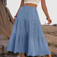 欧米のクロスボーダー2025春夏の新型外国貿易の婦人服のアマゾンのファッションはボタンの大きい振り子のロングスカートの半身のスカートをつなぎ合わせます。