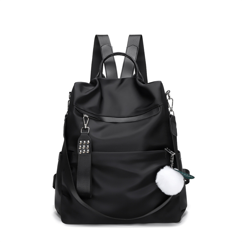 2024 nueva mochila Oxford casual para mujer, remache de moda, mochila de viaje de todo fósforo de color sólido al por mayor