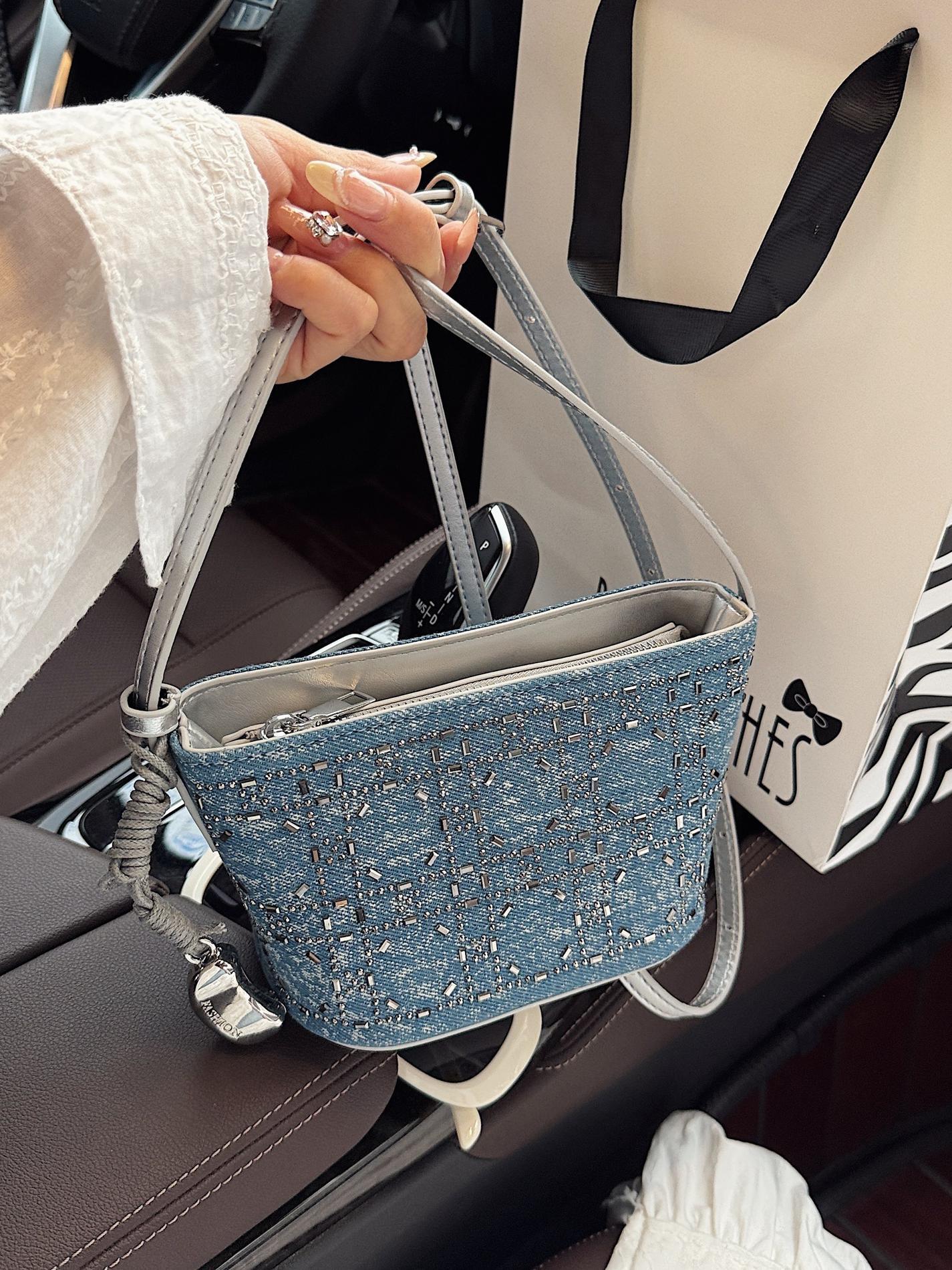 Bolsos pequeños de mezclilla populares de verano para mujer 2025 nuevo estilo estilo occidental todo fósforo moda pequeña bolsa cuadrada textura de moda bolsa de cubo