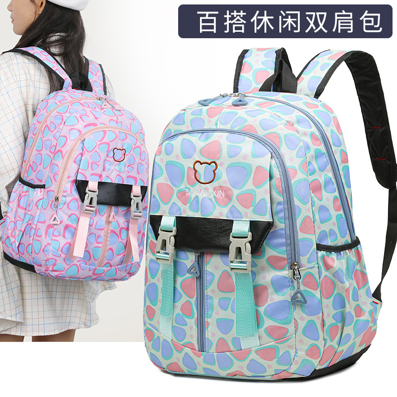 Fábrica al por mayor nueva mochila escolar de estudiantes de primaria y secundaria, mochila ligera de ocio de gran capacidad, mochila de viaje de bolsillo