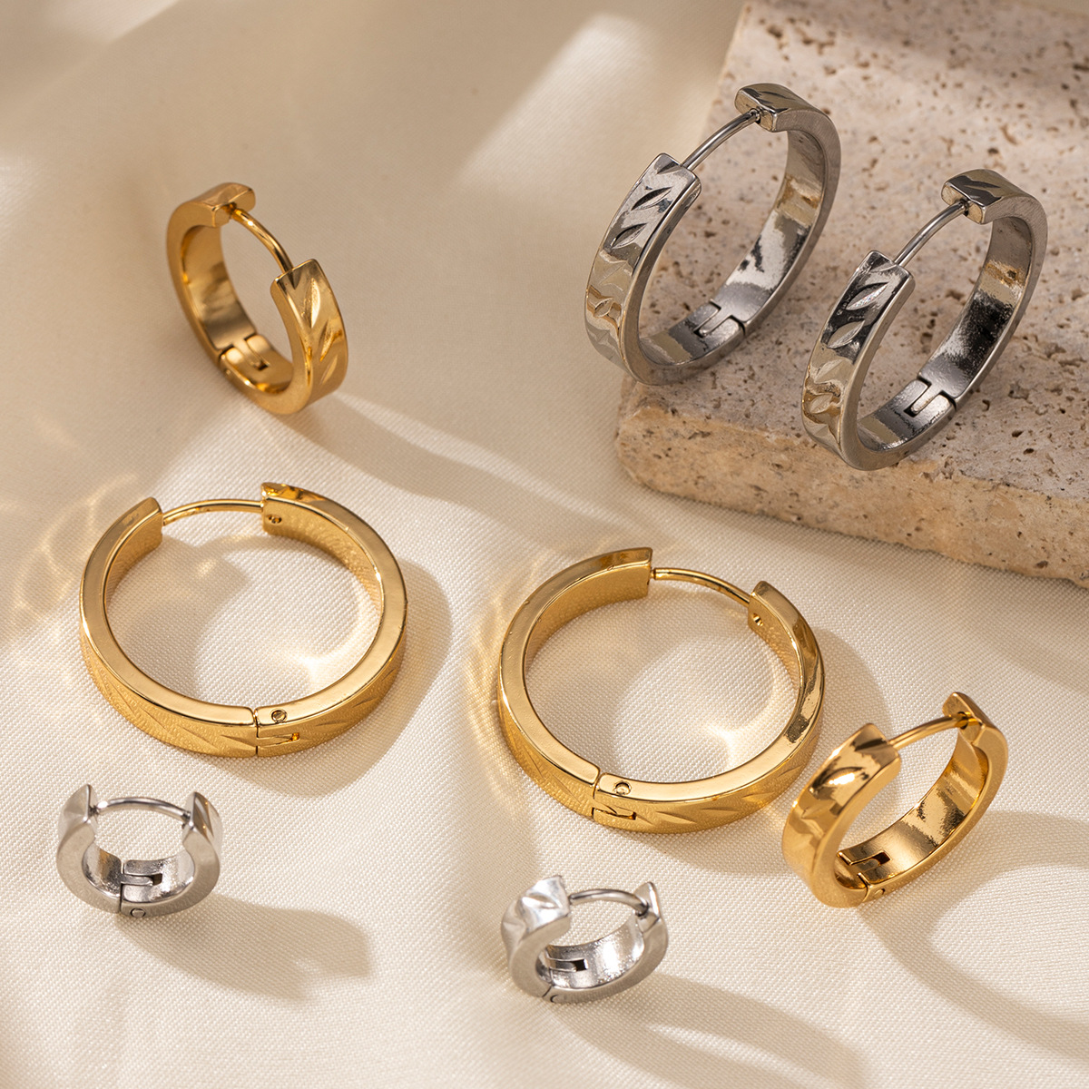 TENA Europa y los Estados Unidos venta transfronteriza aretes de acero de titanio ligero lujo alto sentido de moda personalidad de acero inoxidable joyas de orejas