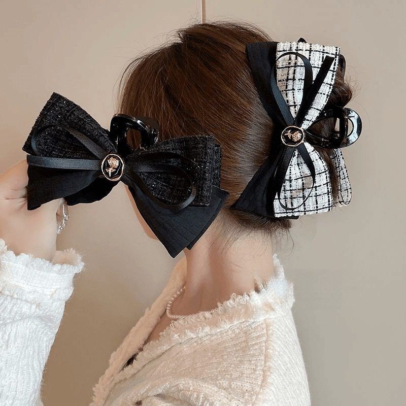 Demi-season elegant black retro sophisticated crab pin with bow