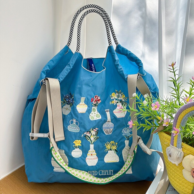 新しい日系ボールチェーン刺繍百合レジ袋小衆万針刺繍ナイロンハンドバッグ環境保護袋|undefined