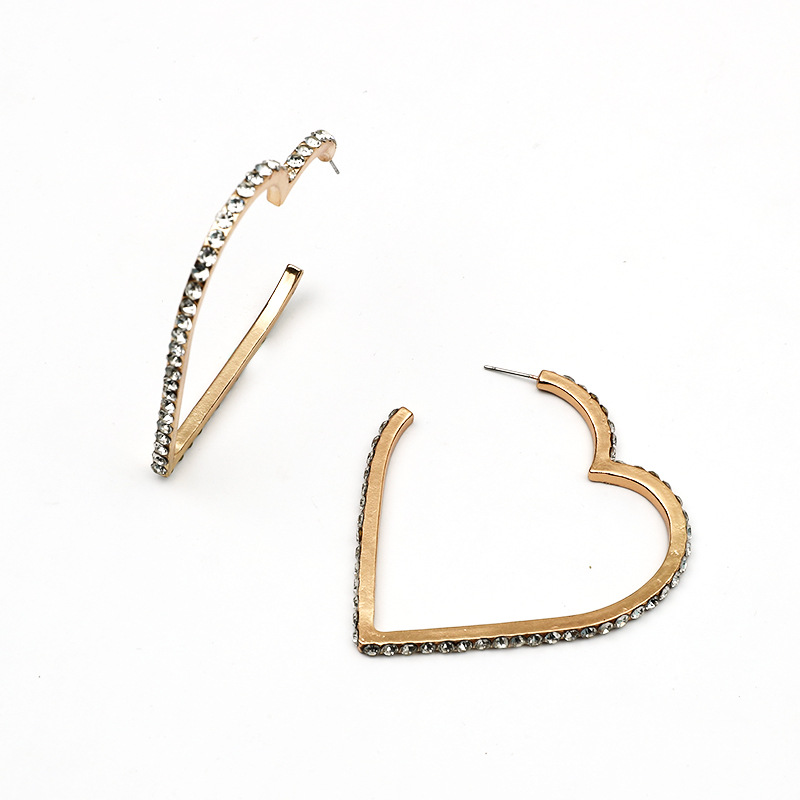 Korean Heart-shaped Hollow Earrings Wholesale Nihaojewelry display picture 1