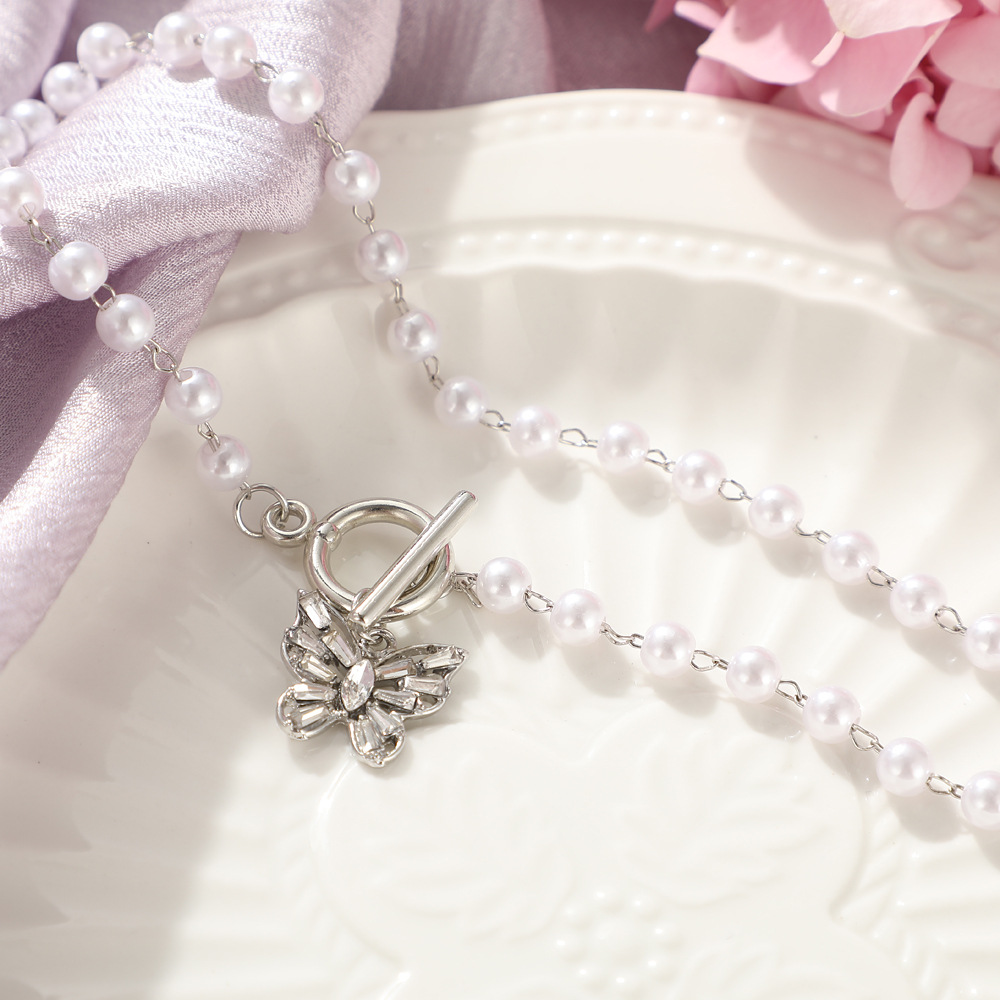 Elegante Gold-überzogene Perle Perlen Schlüsselbein Kette Schmetterling Anhänger Halskette display picture 5