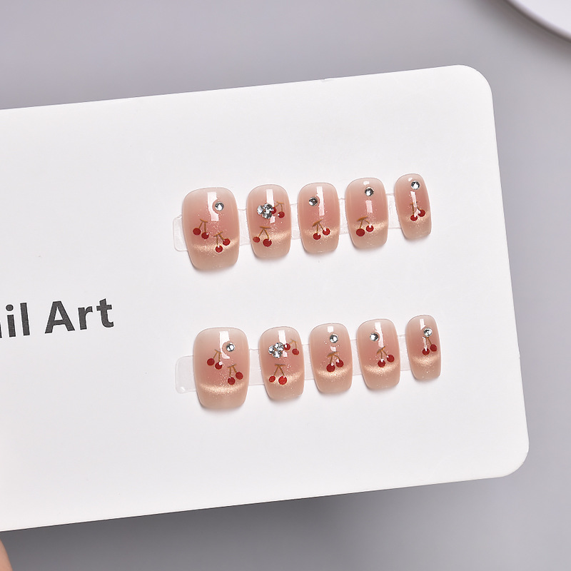Nuevos productos de primavera y verano, ojos de gato, uñas de vestir de cereza francesa, blanco, corto, lindo parche de uñas de cereza tridimensional, uñas
