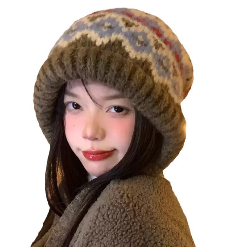 レトロなジャカードのニットは毛糸の帽子を持っています。|undefined